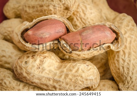 Close up image of Roasted peanuts on brown sack background