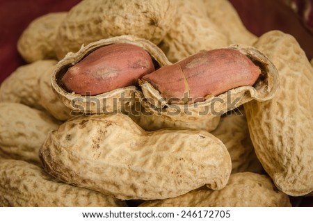 Close up image of Roasted peanuts on brown sack background