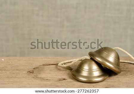 Thai small fingers cymbal on old wood