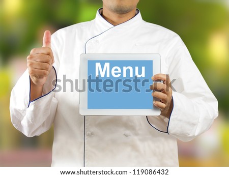 Chef showing a digital tablet with Text Menu