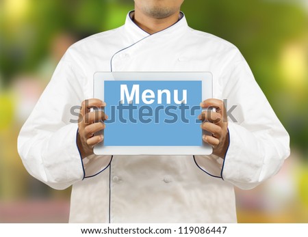 Chef showing a digital tablet with Text Menu