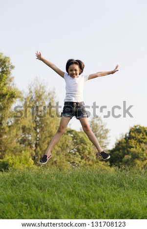 Girl jumping in the park