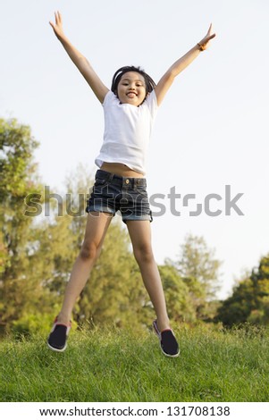Girl jumping in the park