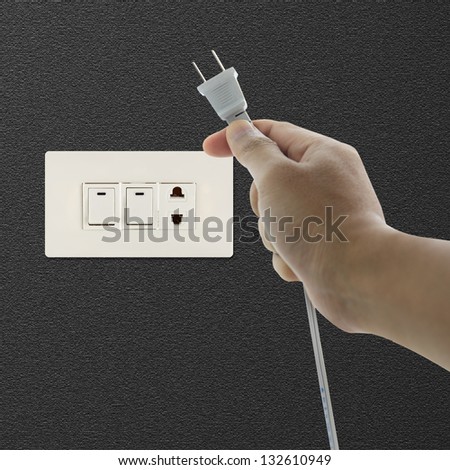 Hand pulling electrical plug