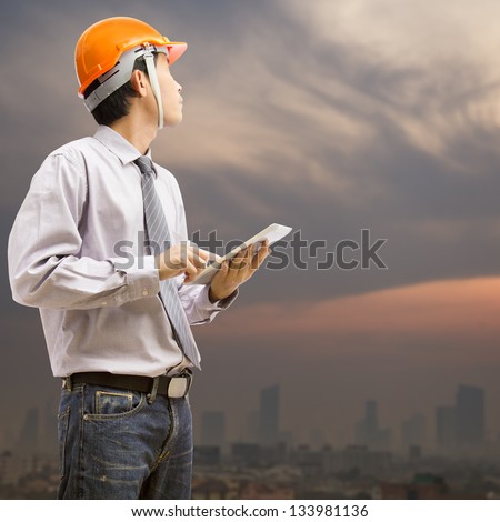 Engineers and architects using digital tablet at working