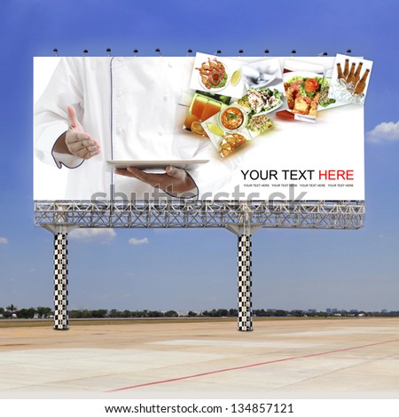 Chef Using Digital Tablet On Outdoor Billboard