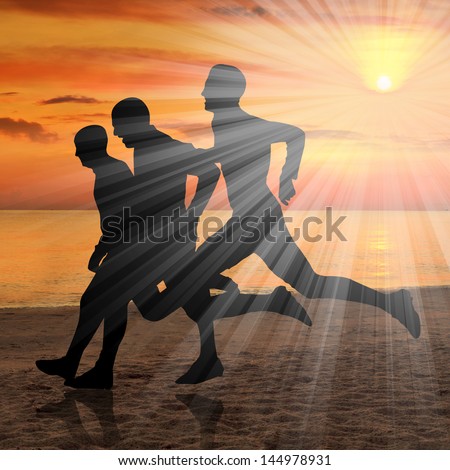 Silhouette of three runners at sunset over ocean