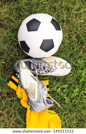 Soccer ball and soccer shoes on the field