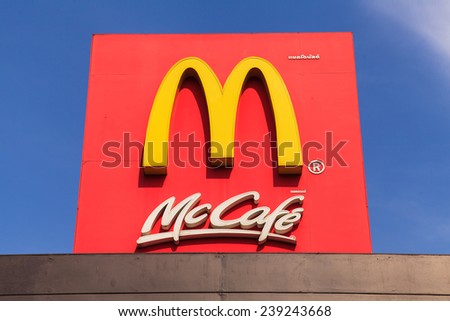 BANGKOK, THAILAND- DECEMBER 22, 2014: McDonalds logo sign with blue sky in Bangkok on 22 December 2014 in Bangkok. It is the world\'s largest chain of hamburger fast food restaurants.