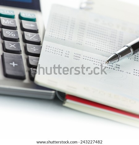 Calculator with Pen on bank account passbook