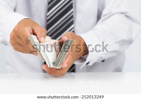 Businessman with huge amount of money