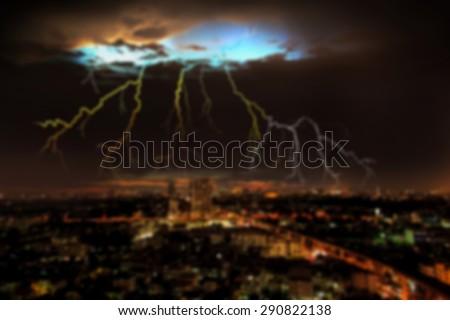 Background with blurred clouds and thunder lightning and storm over the city