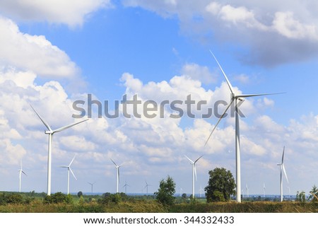 Wind turbine renewable energy source summer landscape with blue sky