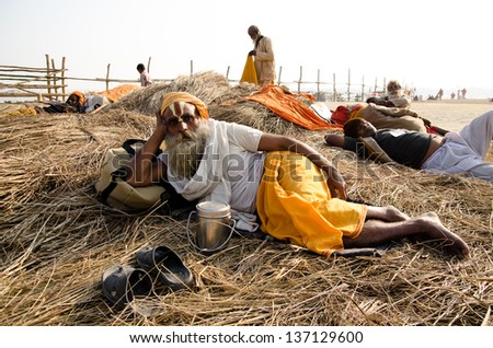 ALLAHBAD, INDIA - 28 JANUARY: Babas (holy men) relax at the Kumbh Mela religious festival on 28 January 2013 in Allahbad. In 2013 it is estimated that 100 million people attended Kumbh Mela.