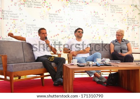 SARAJEVO - AUGUST 17: Nazif Mujic and Danis Tanovic give an interview and answer questions at the opening ceremony of the 19th Sarajevo Film Festival on August 17, 2013 in Sarajevo.