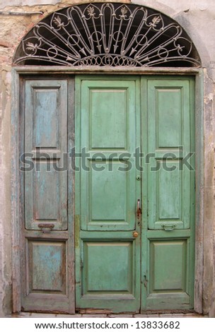 Old green doors in Italian village, Italy