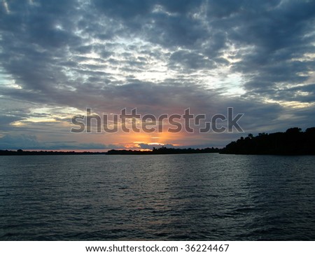 Deep blue sunset on the Rio Negro in the Amazon River basin, Brazil, South America