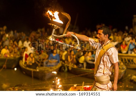 VARANASI, INDIA - OCTOBER 27: A Hindu priest performs \