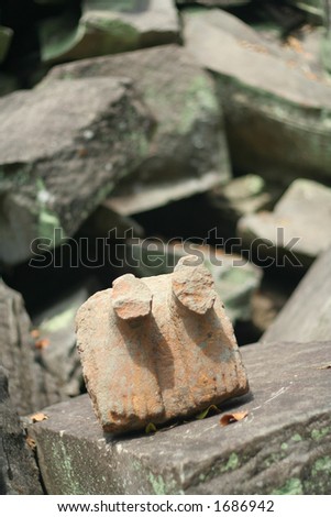 Broken foot statue at Ta Phrom Temple, Siem Reap, Cambodia.