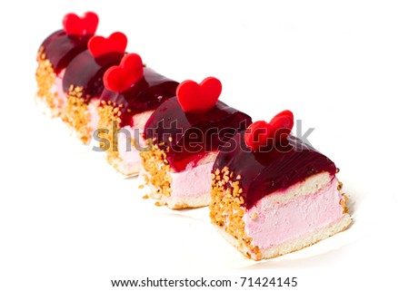 Five cake with nuts, decorated red heart. Isolated on white background.