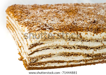 Cake with cream layers. Isolated on white background.