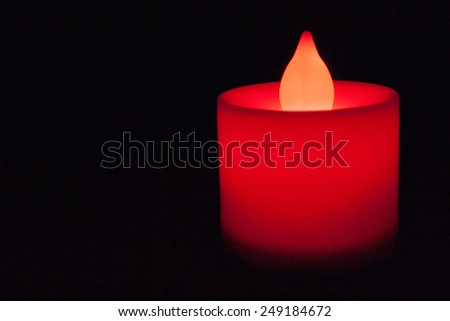 Red electric candle glow in the dark.
