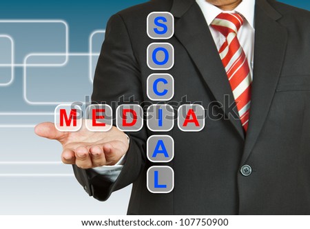 Businessman hand with text Social Media