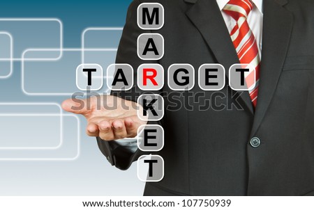 Businessman hand with text target market