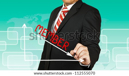 Businessman drawing a graph with Member going down