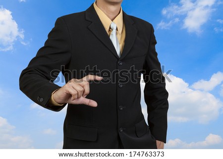 Businessman show his hand on sky background