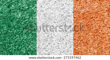 Ireland flag on grass background texture