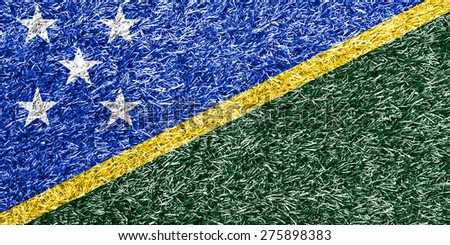 Solomon Islands flag on grass background texture
