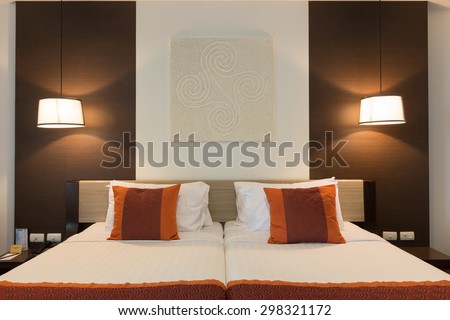 CHA-AM, THAILAND - JUNE 18: Double bed hotel room with lamps turn on in Spring Field at Sea hotel in Cha-am, Thailand during 19 June, 2015