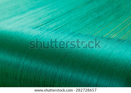Green silk on a warping loom of a textile mill, Silk for weaving on a hand loom