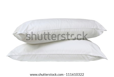 Stack of two fresh, new white bed pillows isolated over white
