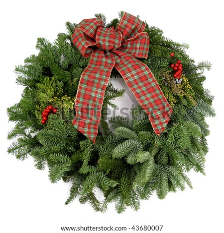 Beautiful, fresh holiday wreath with pine boughs and a bow
