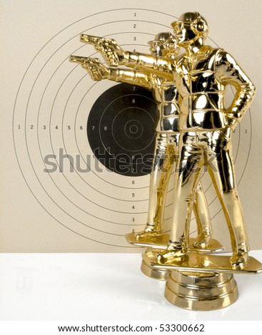 Two shooters aiming against a large target background. See all firearm-related photos from this collection at: http://www.shutterstock.com/sets/22007-guns.html?rid=70583