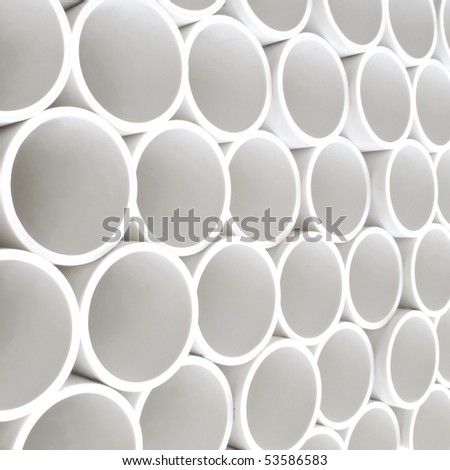 Interesting perspective of new white PVC pipes stacked on a pallet