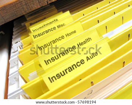 Open file cabinet showing insurance files