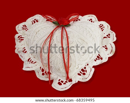 Old hand-tatted lace cushion valentine heart on red satin