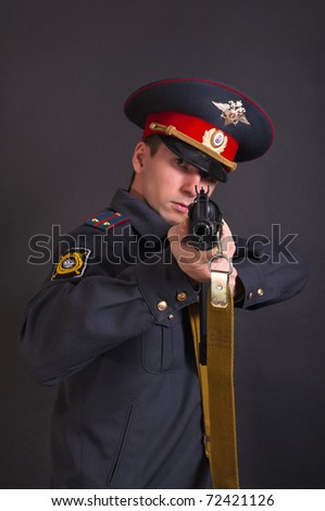 police officer in uniform with a gun