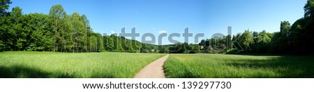 Way through meadows and deciduous forests in spring; panorama/Panorama in spring