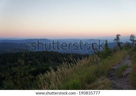 Landscape in the Black Forest in Germany; view over forests, mountains and valleys; endless widths and evening mood/Evening mood in the Black Forest