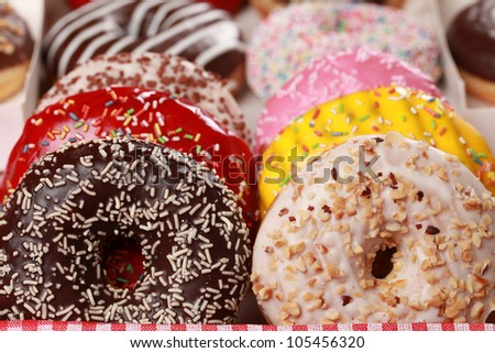 Collection of many colored donuts in a box