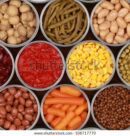 Different kinds of vegetables such as corn, peas and tomatoes in cans