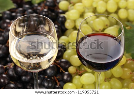 Red wine and white wine in glasses with selective focus
