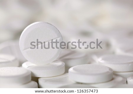 A white pill on other pills, lots of copyspace
