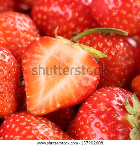 Macro shot of a fresh organic strawberry with more strawberries in the background