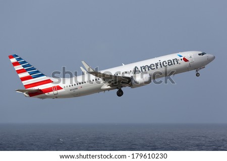 CURACAO - FEBRUARY 16: An American Airlines Boeing 737 taking off on February 16, 2014 in Curacao. American Airlines is the world\'s largest airline with 619 aircraft and 108 million passengers.
