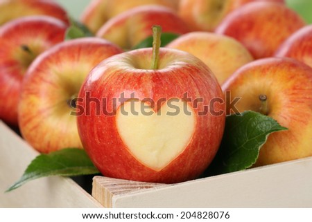 Apple with heart in a box love topic